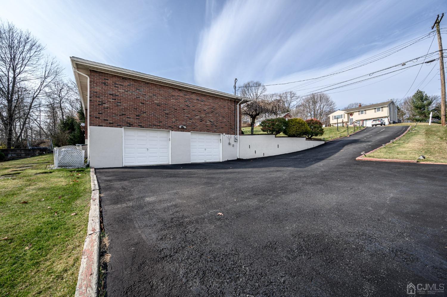 7 Putters Road Succasunna, NJ 07876 - Photo 35 of 40 a view of a house with a yard and garage