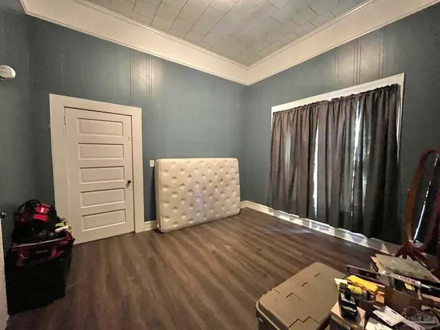 a view of an empty room with a dresser