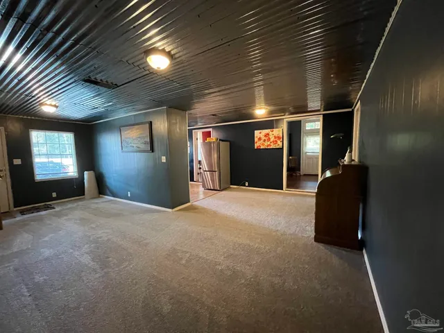 a view of an empty room and window