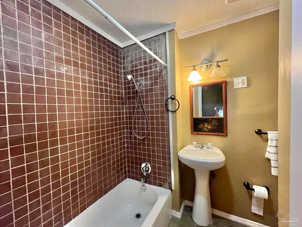 a bathroom with a sink and mirror