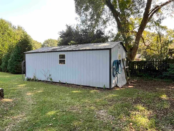 a view of a backyard with a barn