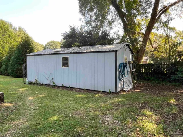a view of a backyard with a barn