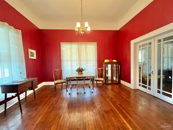 a view of a livingroom with furniture window and wooden floor