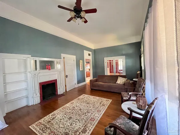 a living room with furniture and a fireplace