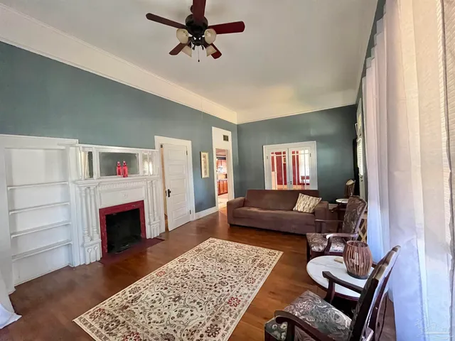 a living room with furniture and a fireplace
