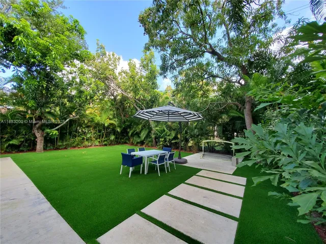 a view of an outdoor sitting area with furniture
