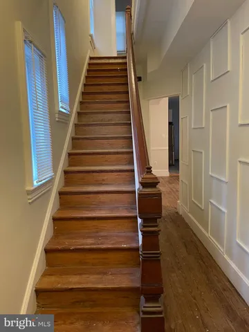 a view of entryway with wooden floor