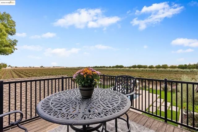 a view of a backyard with sitting area