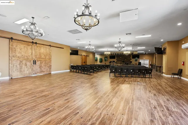 a view of a dining area with furniture window and wooden floor