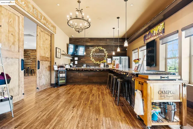 a living room with furniture a rug and white walls