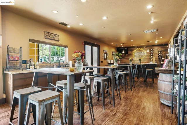 a view of hall way with mirror and furniture