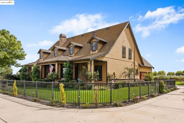 a balcony with furniture and a potted plant