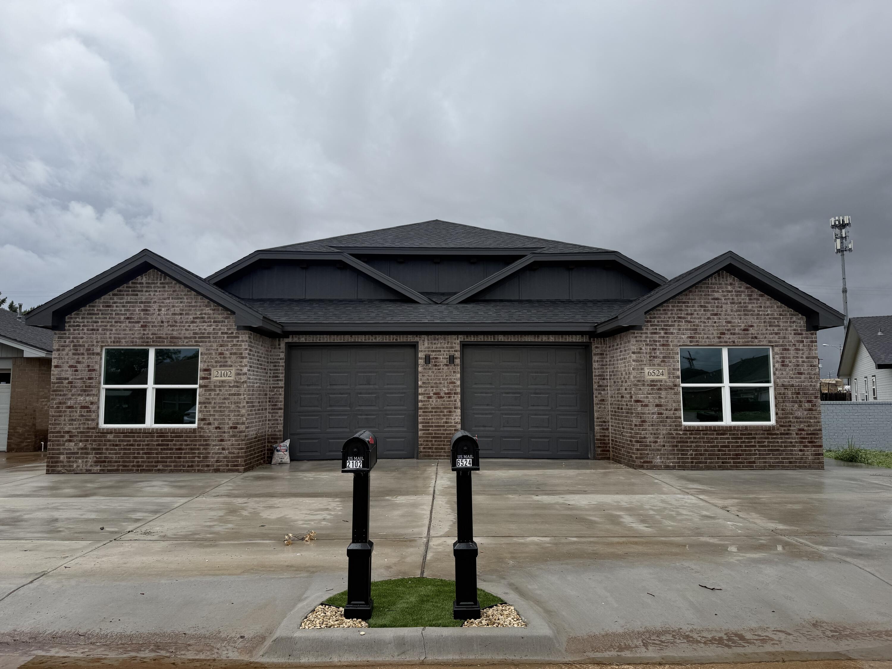 a front view of a house with garage