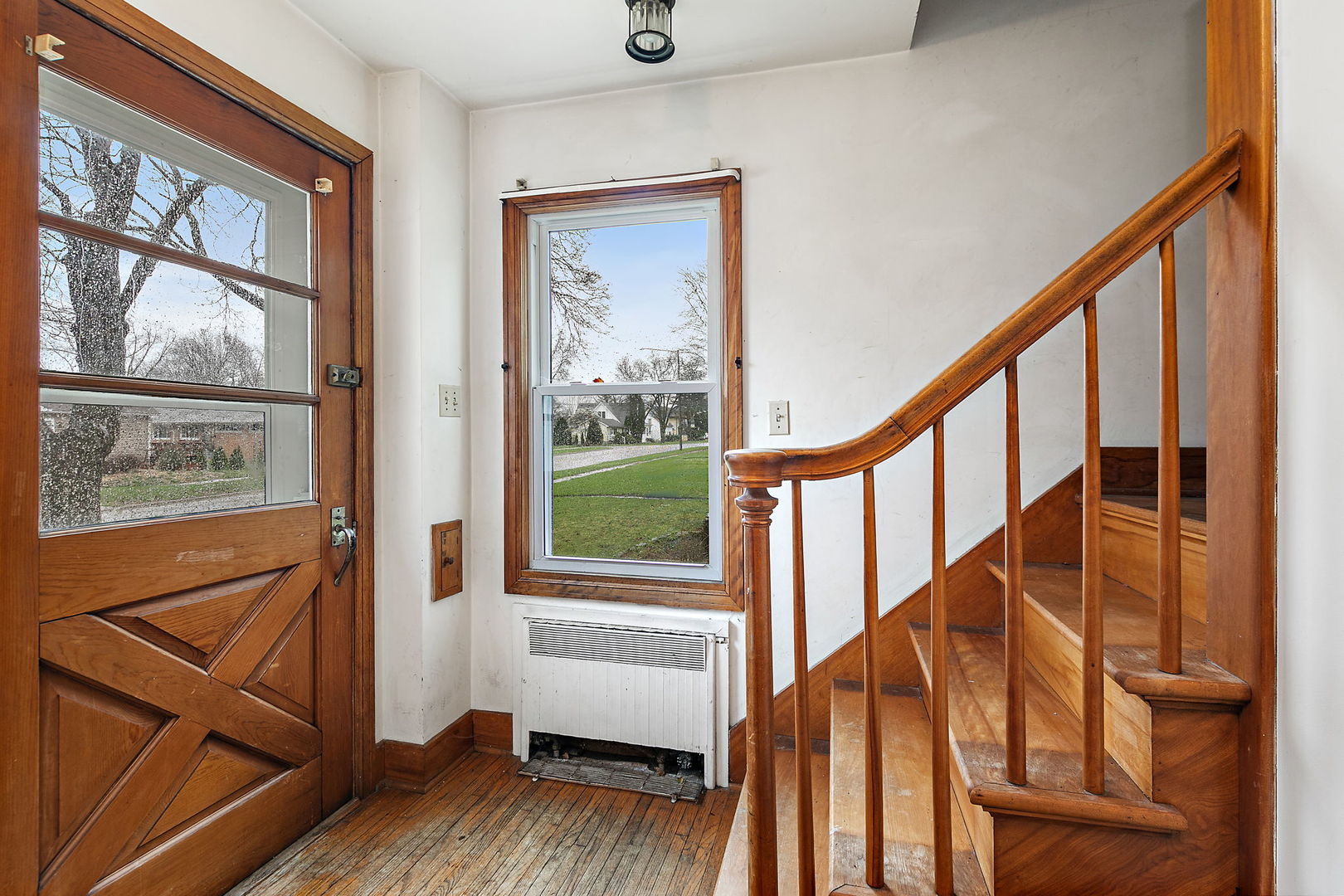 820 Lincoln Highway Rochelle, IL 61068 - Photo 3 of 27 a view of an entryway with wooden floor and door
