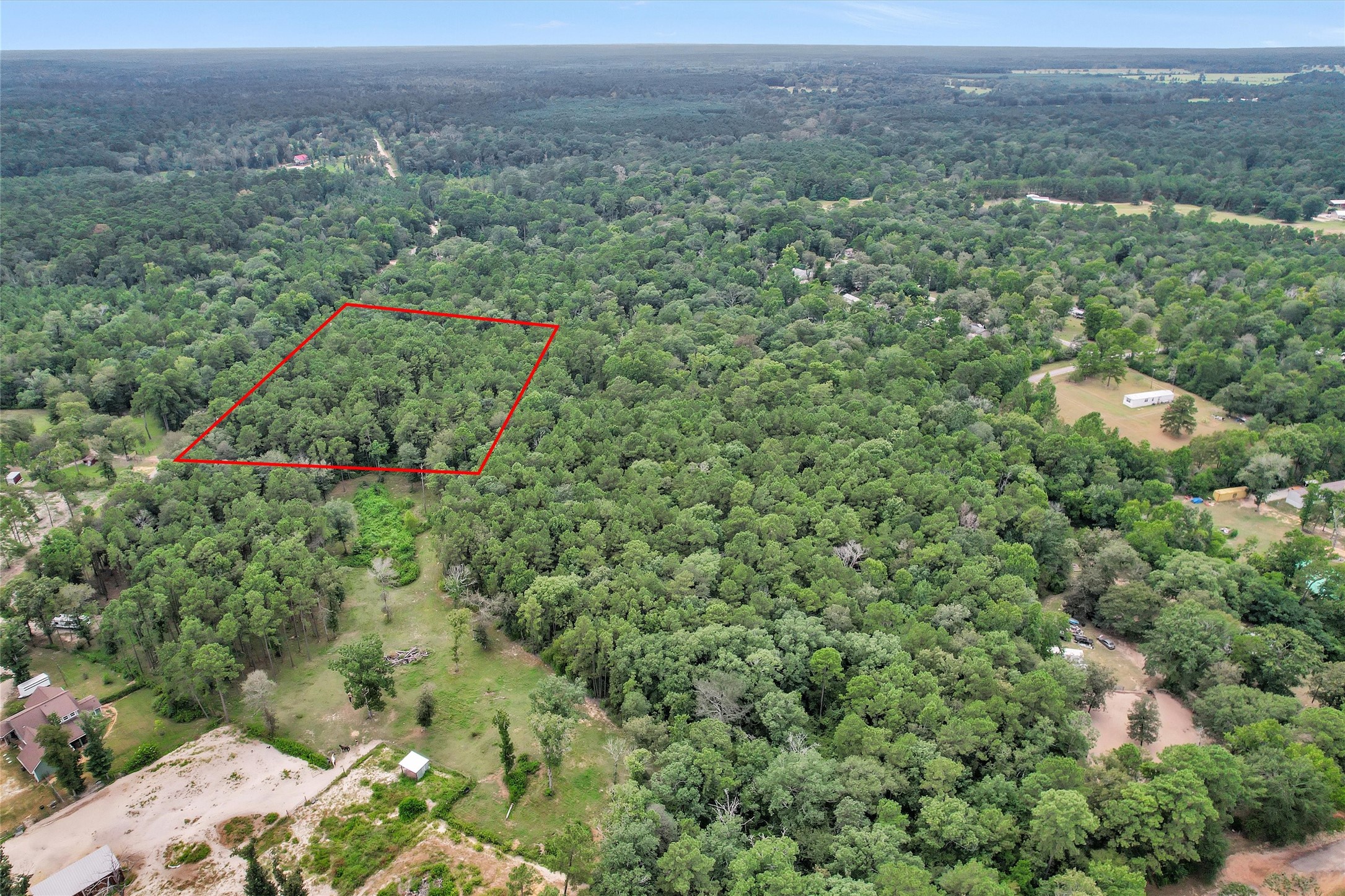 Lot 20 East Double Creek Road Willis, TX 77378 - Photo 4 of 13 an aerial view of a houses with a yard