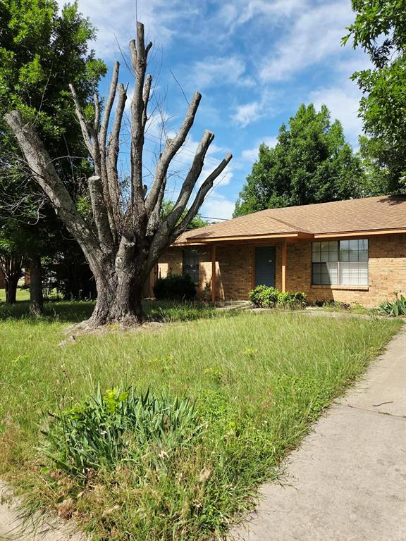 722 South Church Street Pilot Point, TX 76258 - Photo 37 of 37 a front view of a house with a yard