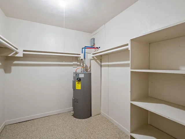 a view of storage and utility room with empty racks