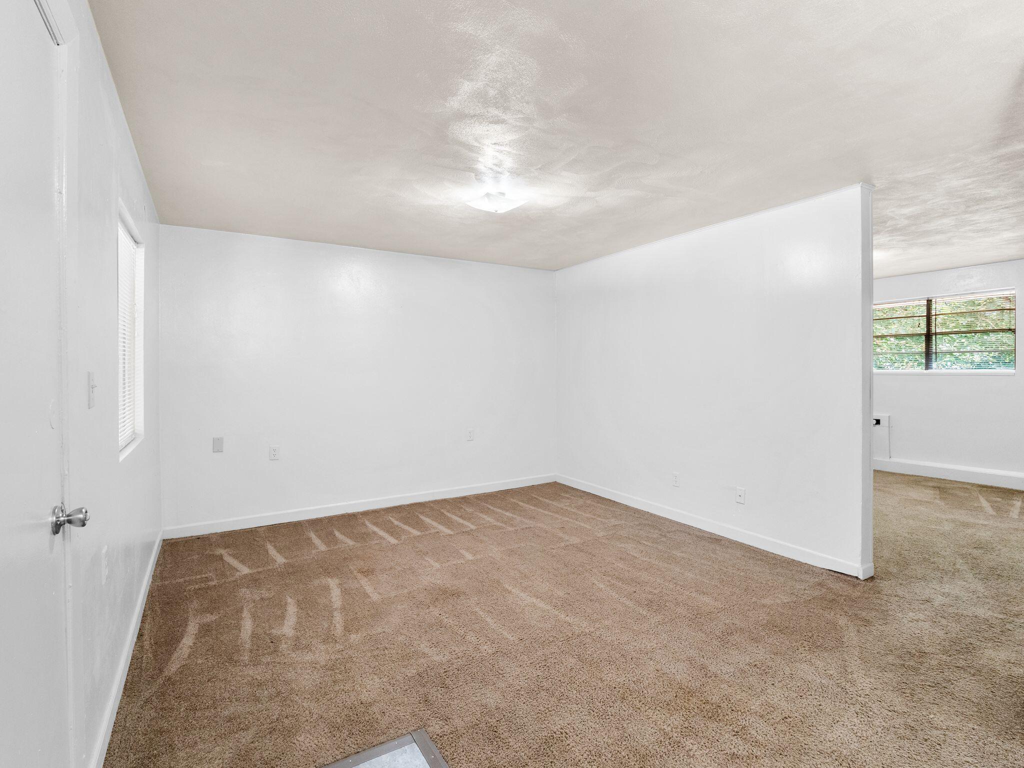 300 Ridgeview Lane, Unit 62 Bassett, VA 24055 - Photo 22 of 23 an empty room with windows