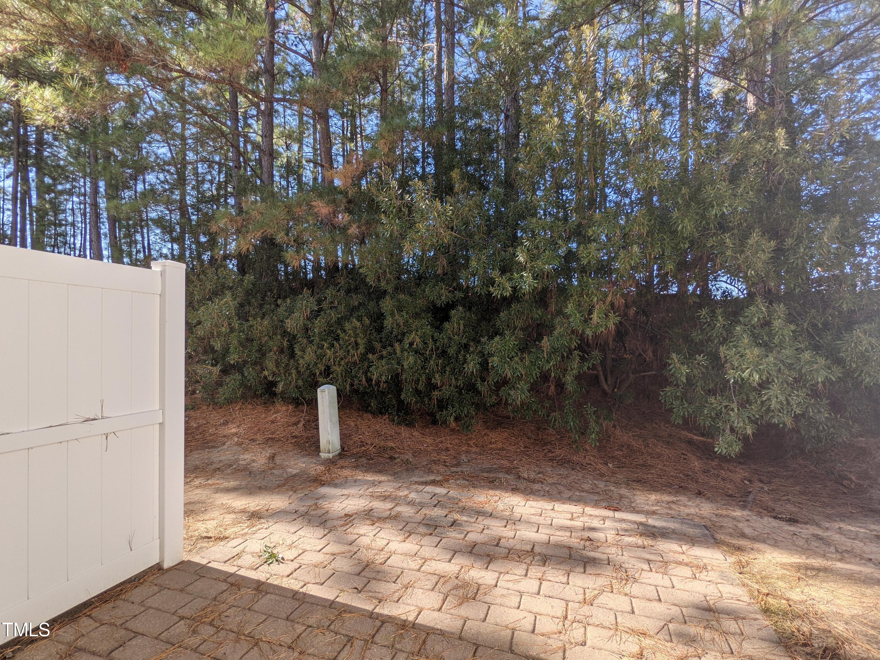 424 St John Drive Durham, NC 27703 - Photo 14 of 14 a backyard of a house with lots of green space