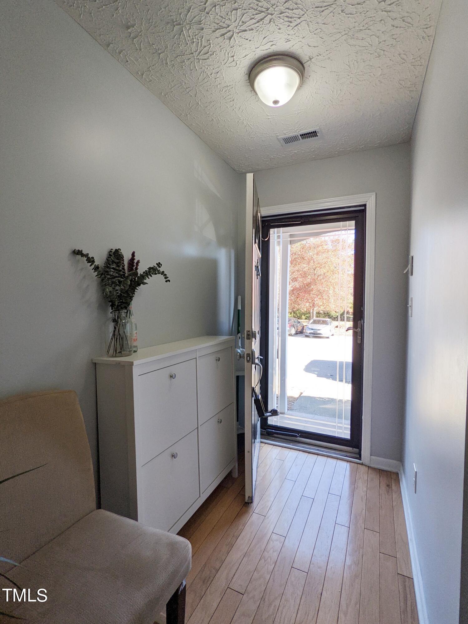 424 St John Drive Durham, NC 27703 - Photo 2 of 14 a view of a room that has a bed and a window