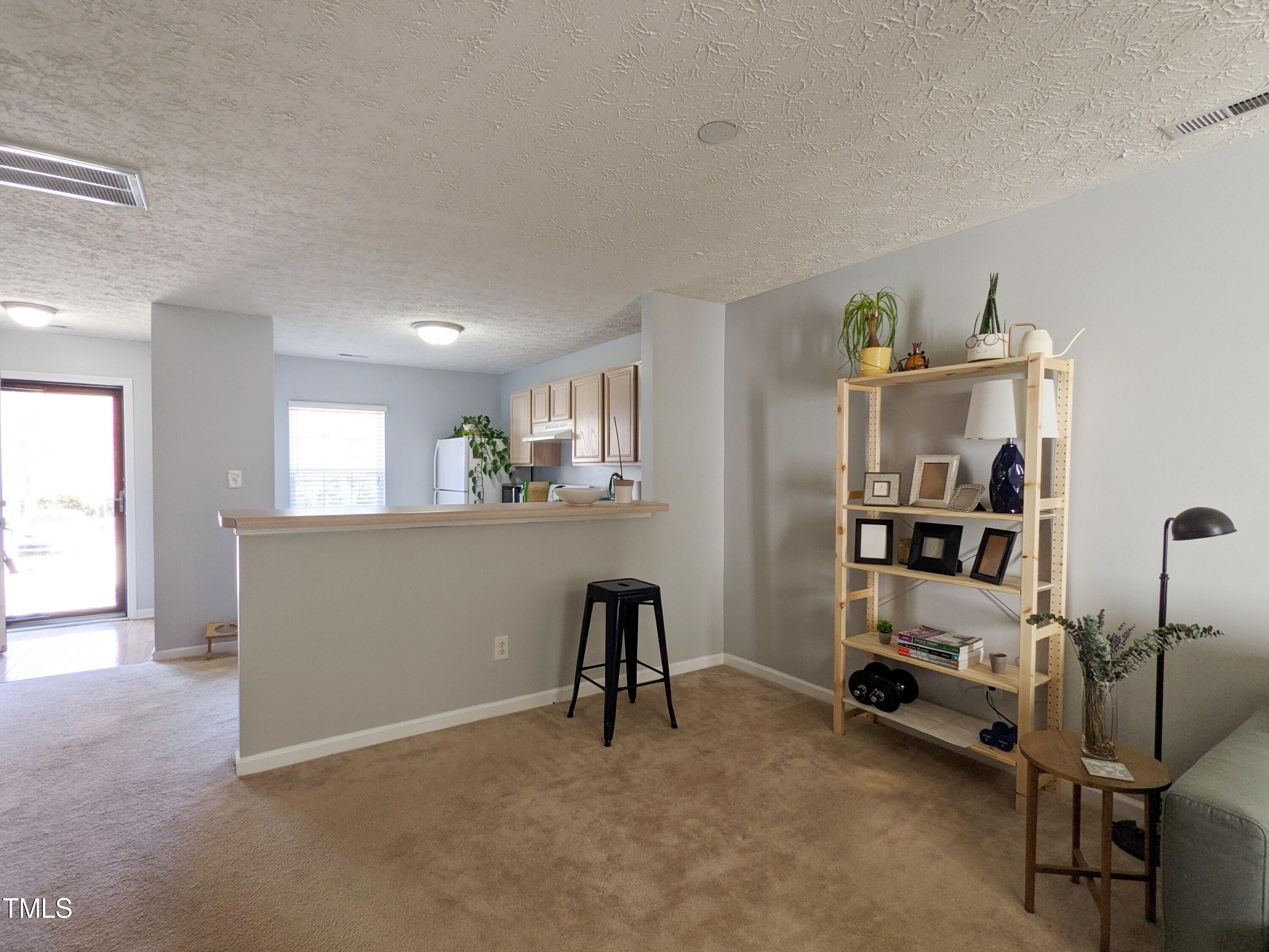 424 St John Drive Durham, NC 27703 - Photo 5 of 14 a view of workspace with furniture and window