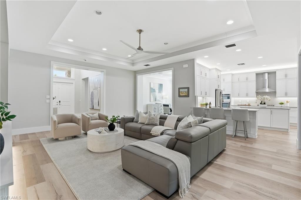 12021 Azalea Way Naples, FL 34120 - Photo 11 of 50 Ten foot high ceilings and the coffer ceiling makes it 11 feet high with abundant recessed lights and large ceiling fan.