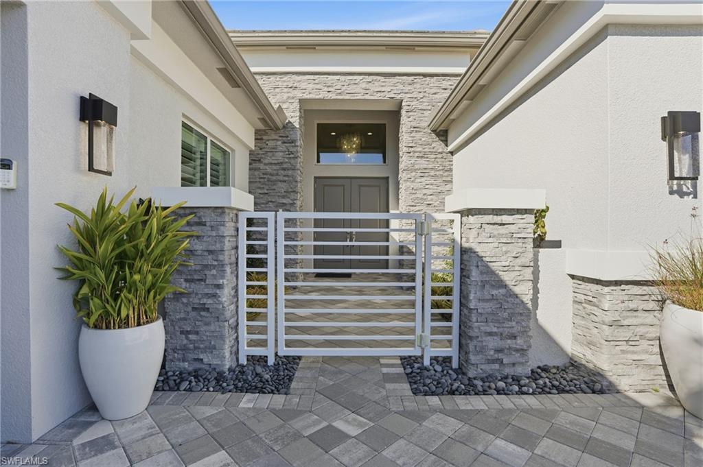 12021 Azalea Way Naples, FL 34120 - Photo 6 of 50 Handsome gated front entry.