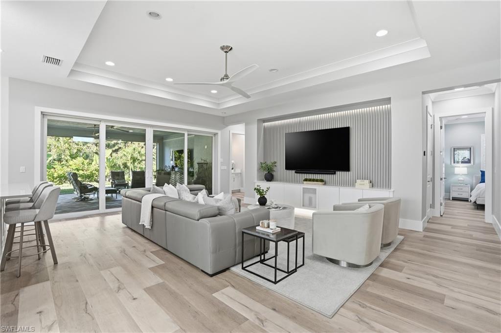 12021 Azalea Way Naples, FL 34120 - Photo 9 of 50 Open living overlooking the elegant garden and preserve.