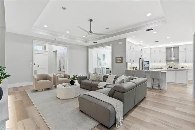 a spacious bathroom with a double vanity sink a mirror and a shower
