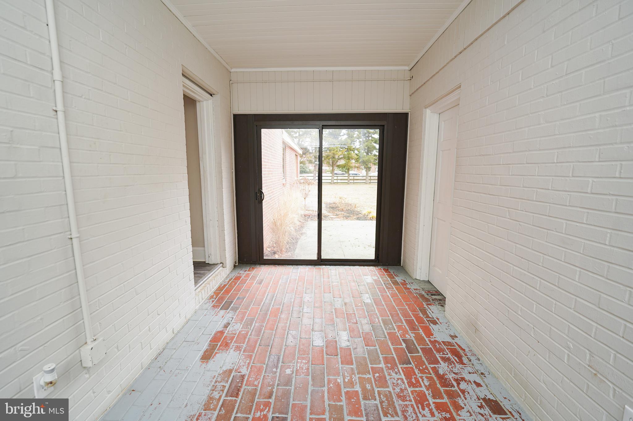 215 Pine Bluff Road Salisbury, MD 21801 - Photo 23 of 75 an empty room with wooden floor and windows