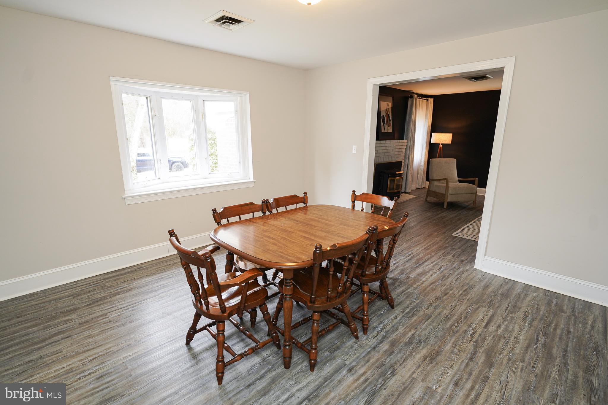 215 Pine Bluff Road Salisbury, MD 21801 - Photo 24 of 75 a dining room with furniture and wooden floor