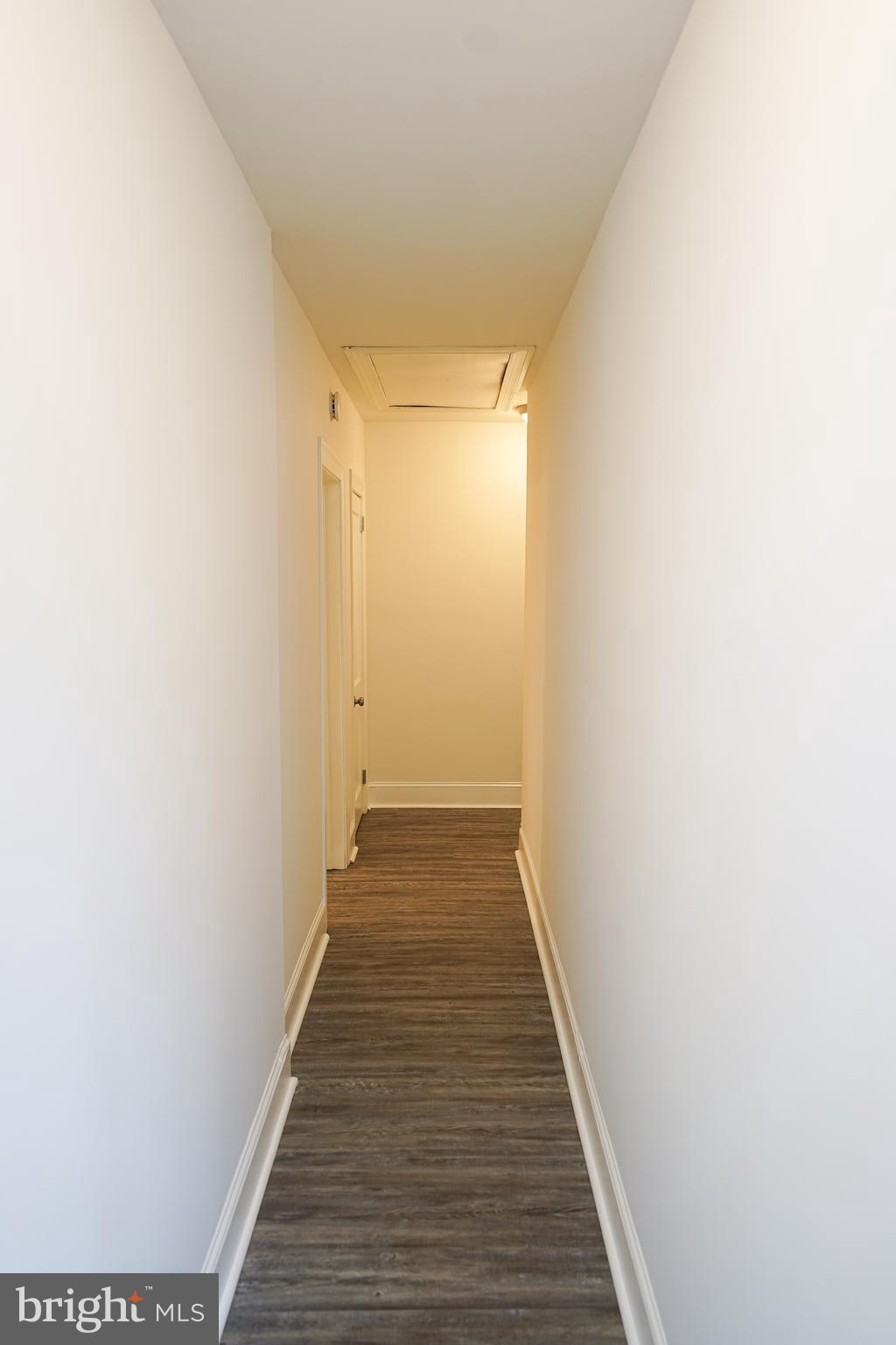 215 Pine Bluff Road Salisbury, MD 21801 - Photo 29 of 75 a view of a hallway with wooden floor