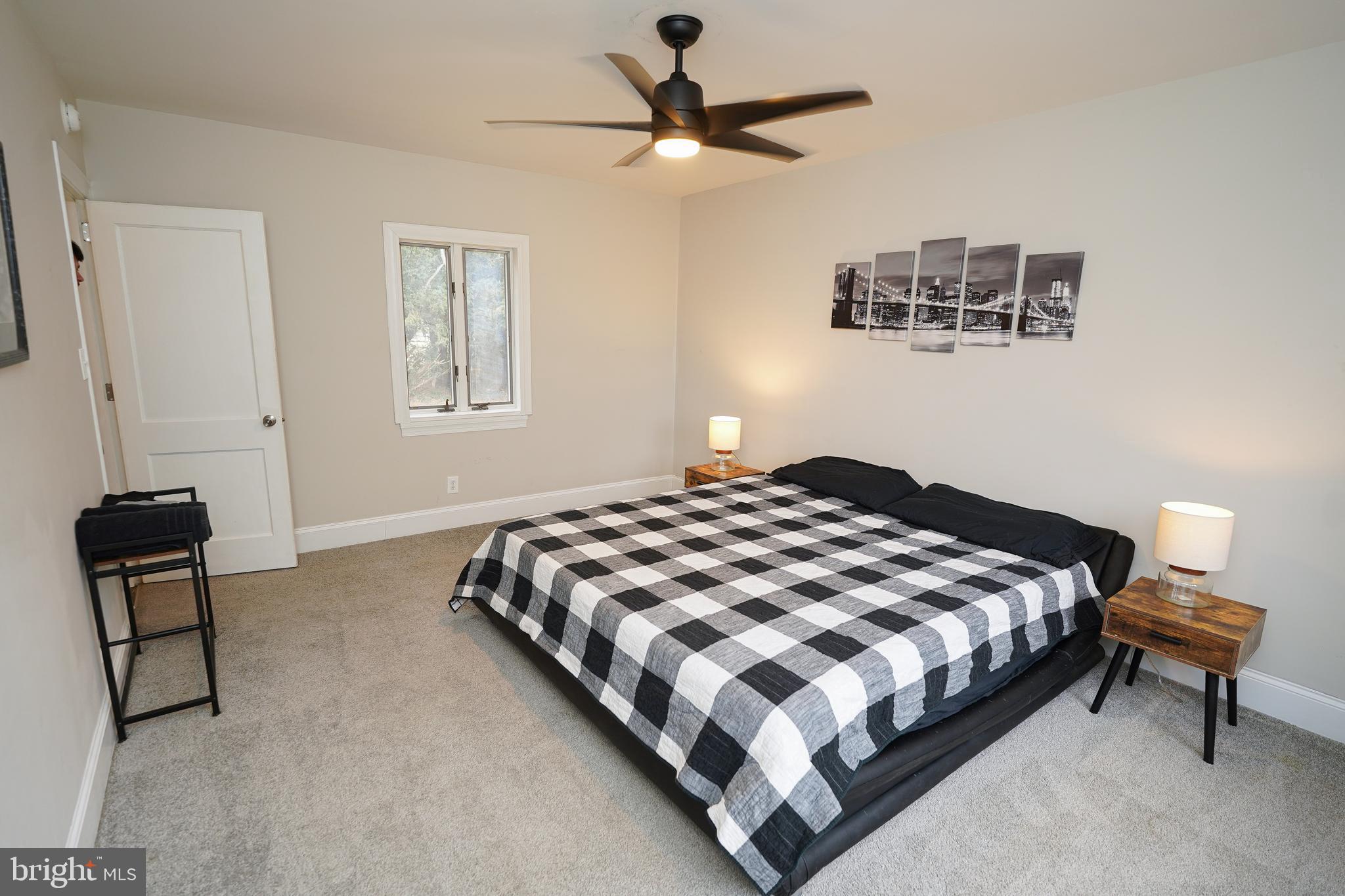 215 Pine Bluff Road Salisbury, MD 21801 - Photo 30 of 75 a bedroom with a bed and a chair