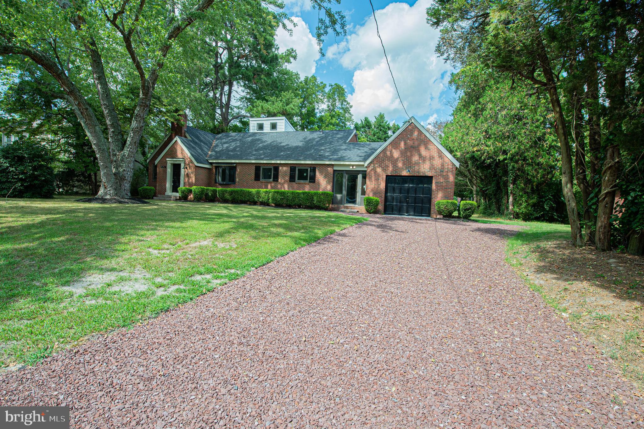 215 Pine Bluff Road Salisbury, MD 21801 - Photo 3 of 75 a front view of a house with a garden and trees