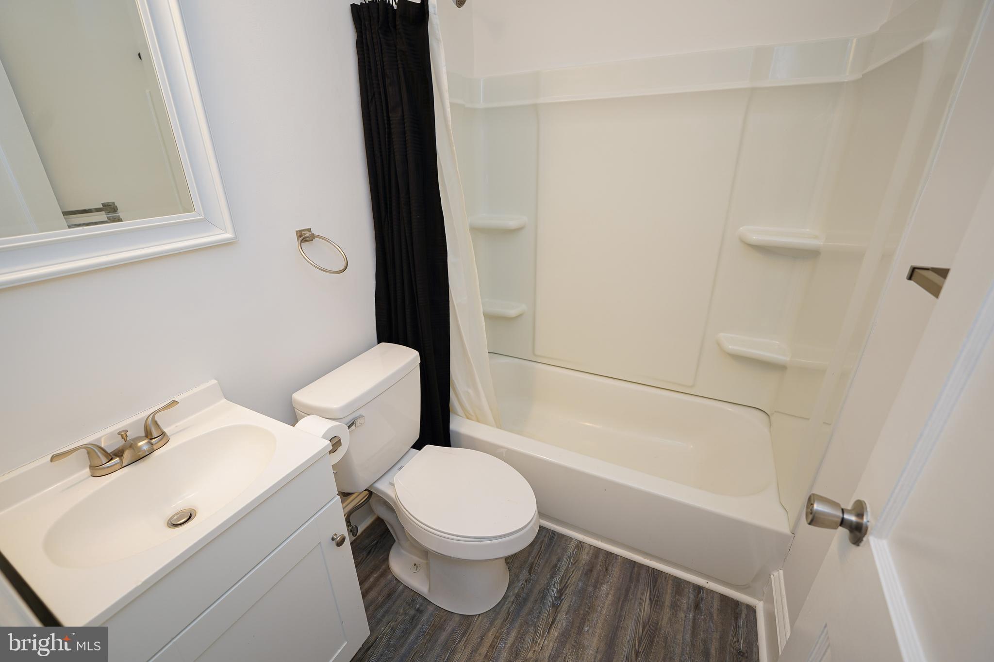 215 Pine Bluff Road Salisbury, MD 21801 - Photo 34 of 75 a bathroom with a toilet sink and shower