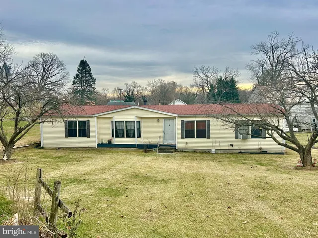 a house that has a big yard in front of it