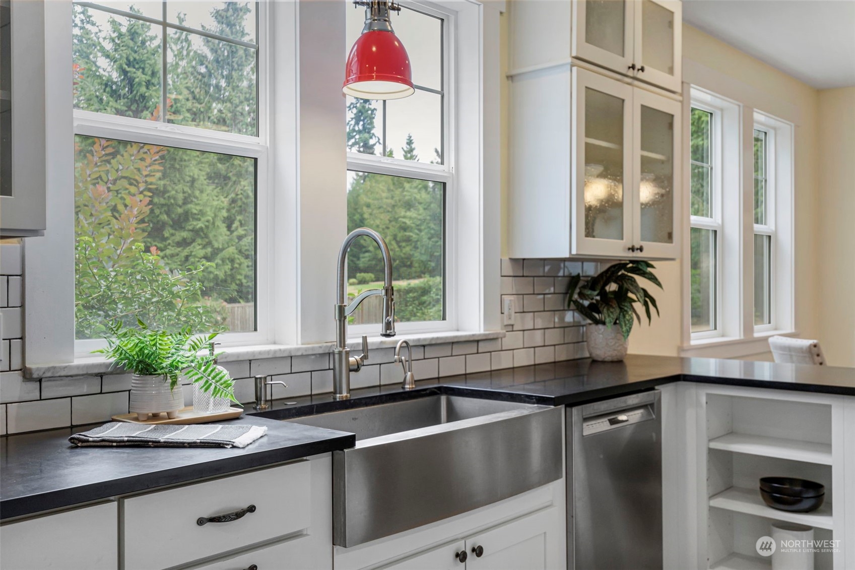6457 Haley Loop Road Northeast Bainbridge Island, WA 98110 - Photo 15 of 40 a kitchen with a sink and a large window