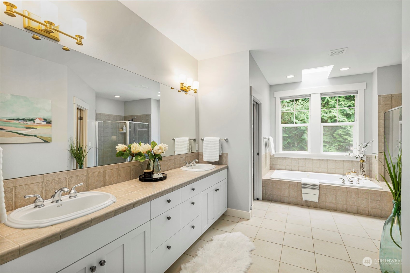 6457 Haley Loop Road Northeast Bainbridge Island, WA 98110 - Photo 21 of 40 a bathroom with a tub sink and mirror