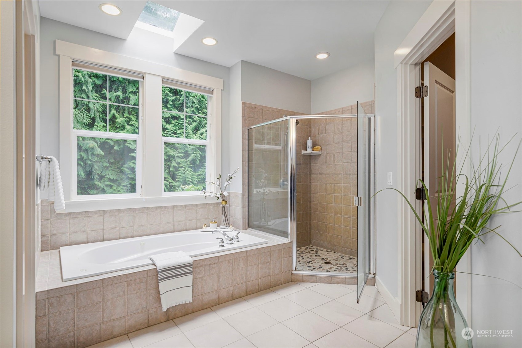 6457 Haley Loop Road Northeast Bainbridge Island, WA 98110 - Photo 22 of 40 a bathroom with a bathtub shower and a sink