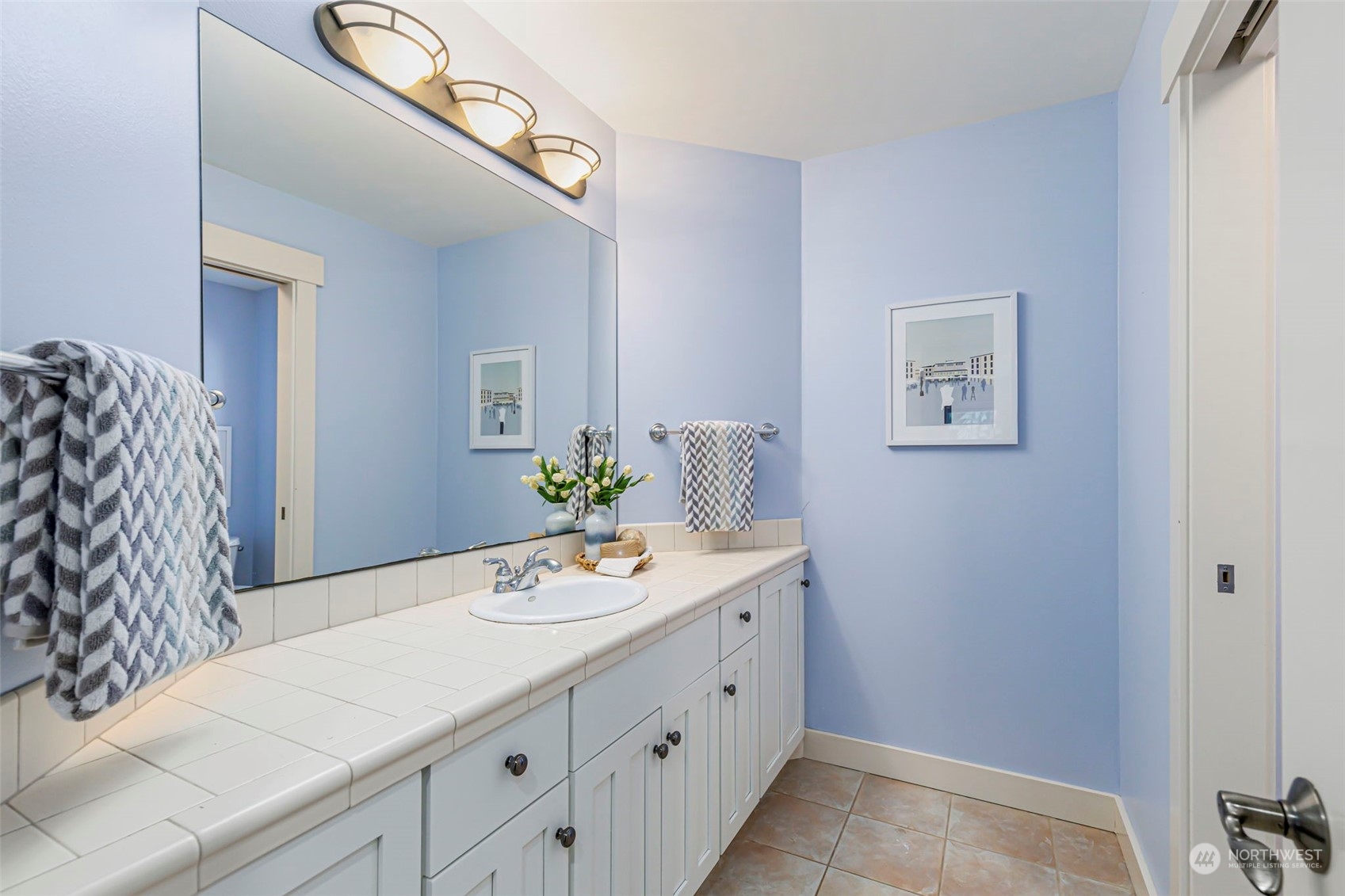 6457 Haley Loop Road Northeast Bainbridge Island, WA 98110 - Photo 26 of 40 a bathroom with a sink and a mirror
