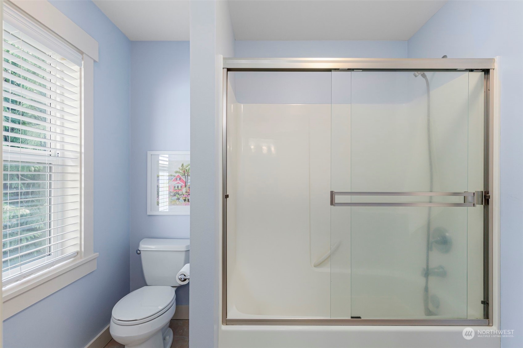6457 Haley Loop Road Northeast Bainbridge Island, WA 98110 - Photo 27 of 40 a bathroom with a shower a toilet and a window