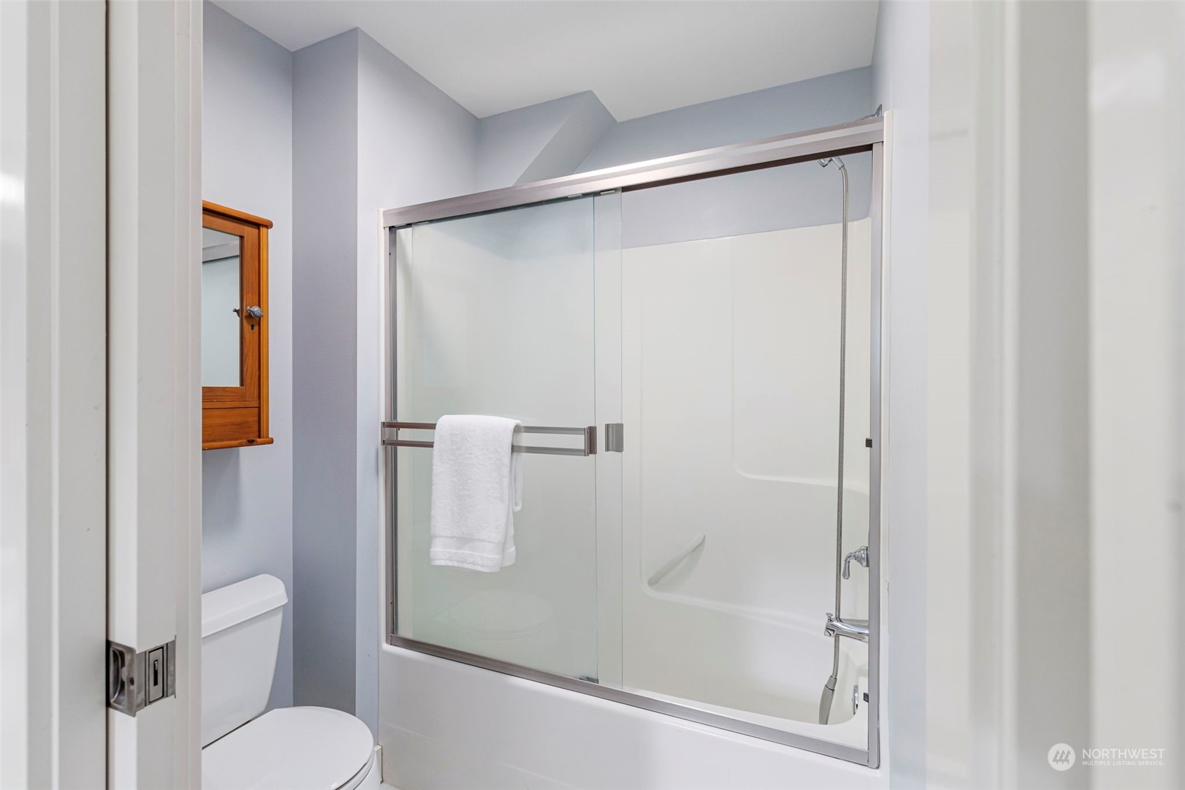 6457 Haley Loop Road Northeast Bainbridge Island, WA 98110 - Photo 30 of 40 a bathroom with a shower and toilet