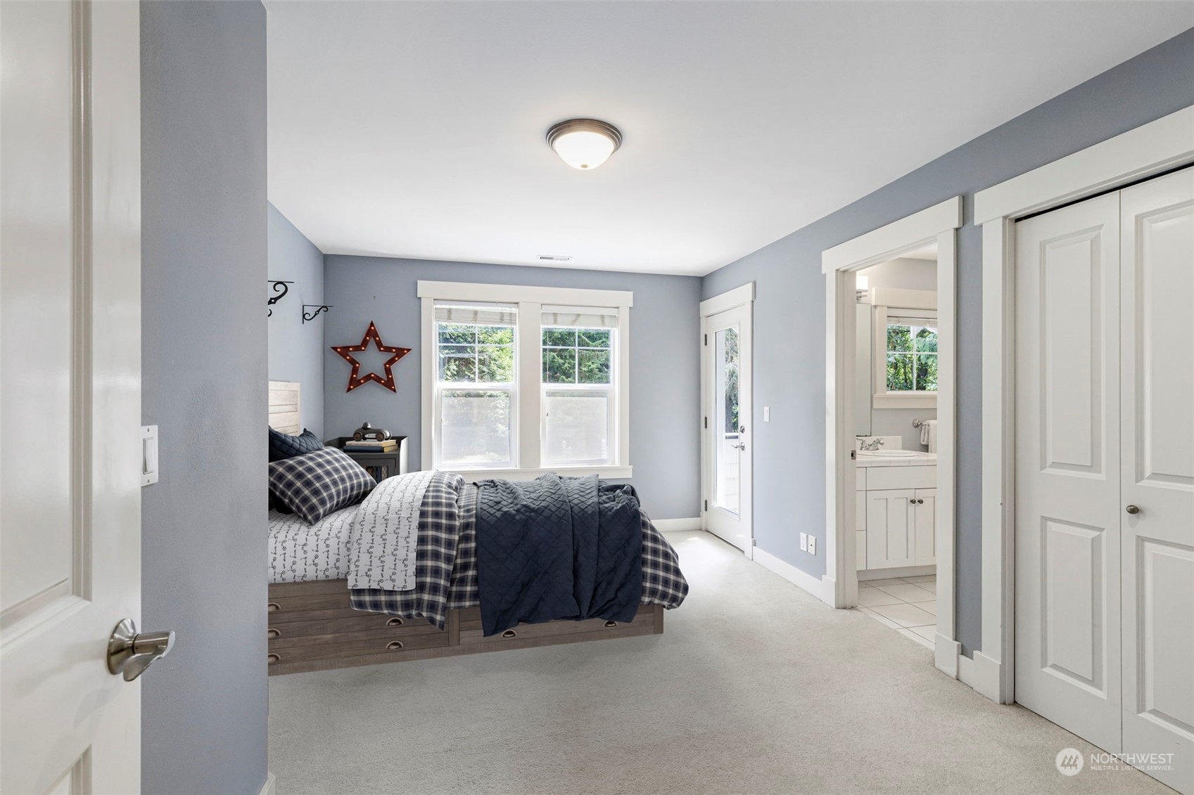 6457 Haley Loop Road Northeast Bainbridge Island, WA 98110 - Photo 31 of 40 a bedroom with a bed and a window
