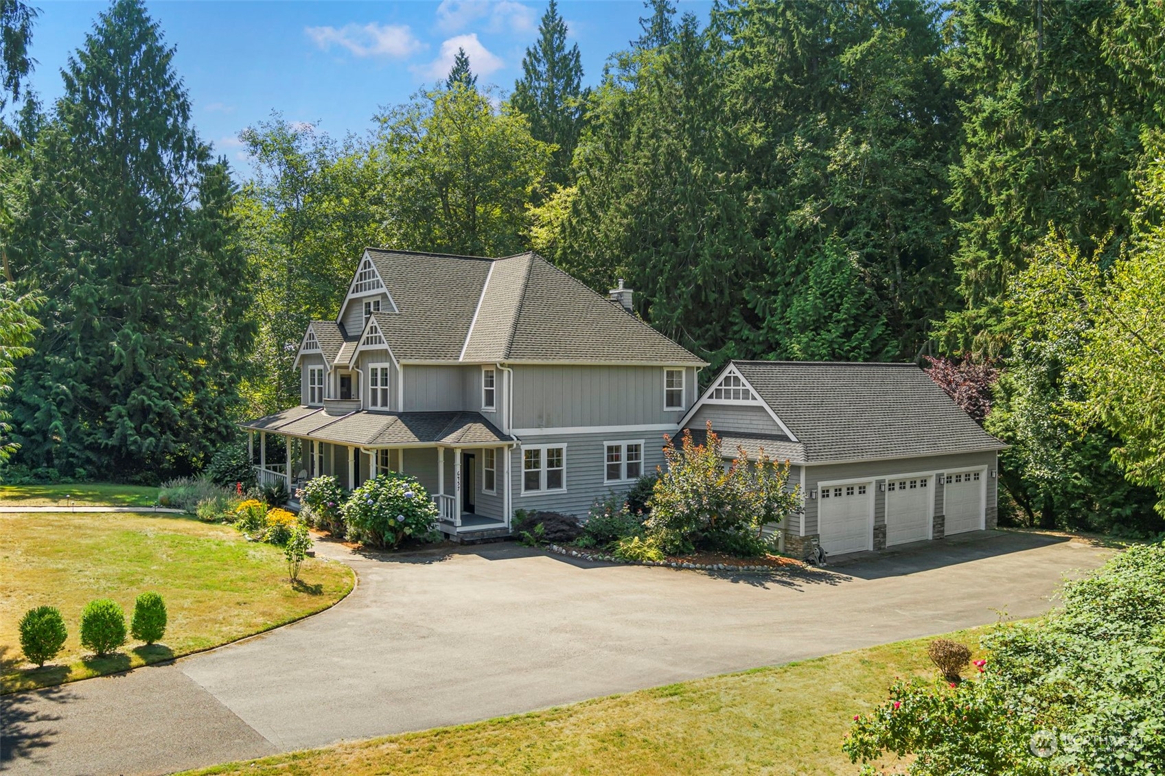6457 Haley Loop Road Northeast Bainbridge Island, WA 98110 - Photo 39 of 40 a front view of a house with yard and trees