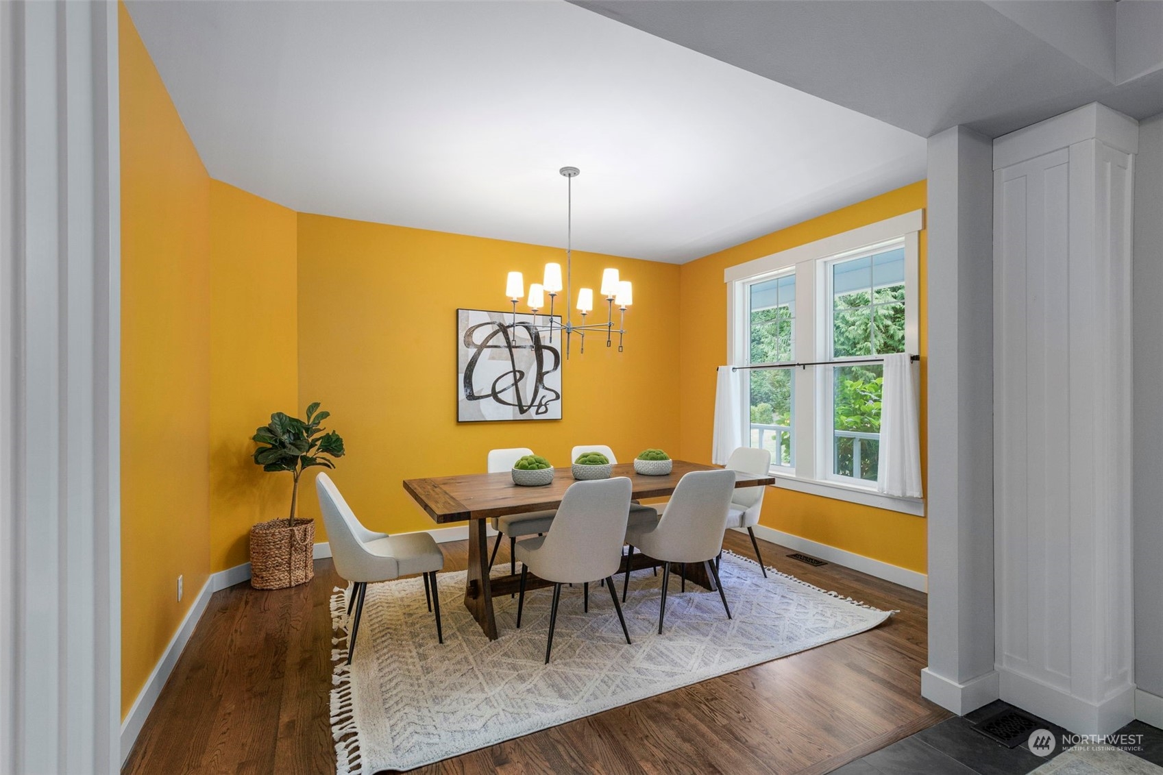 6457 Haley Loop Road Northeast Bainbridge Island, WA 98110 - Photo 7 of 40 a view of a dining room with furniture and chandelier