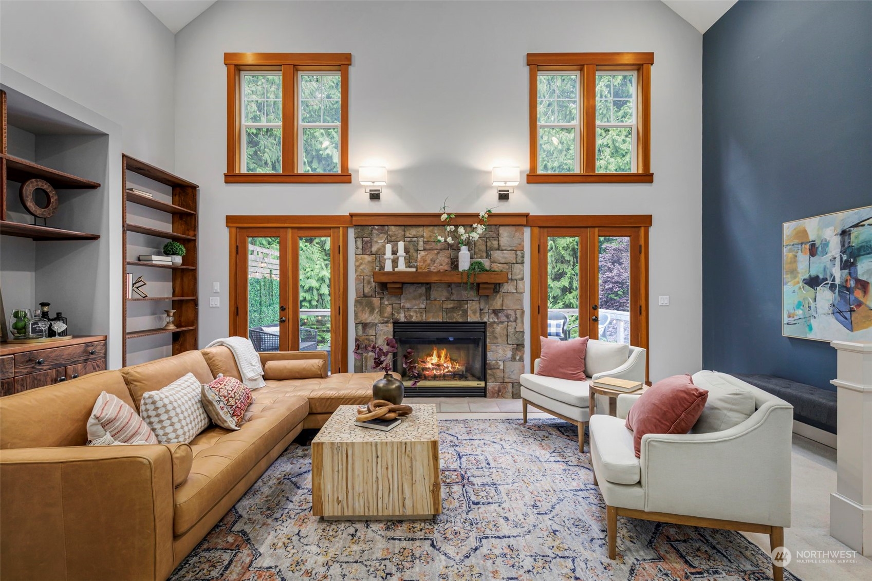 6457 Haley Loop Road Northeast Bainbridge Island, WA 98110 - Photo 8 of 40 a living room with furniture fireplace and a large window