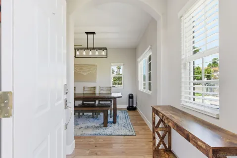 a view of a dining room with furniture window and outside view