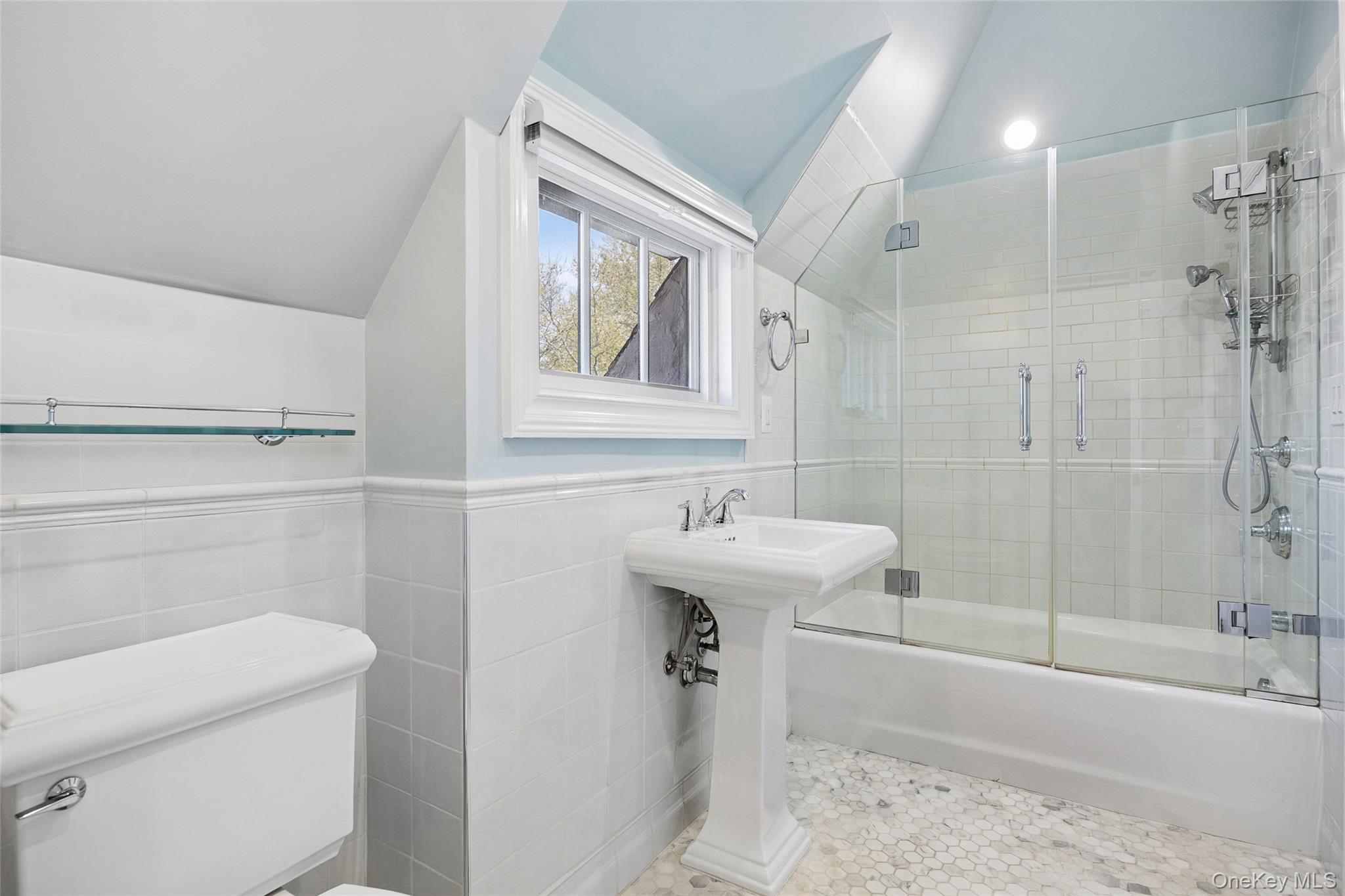 216 Beverly Road Queens, NY 11363 - Photo 9 of 50 a bathroom with a sink a toilet and shower