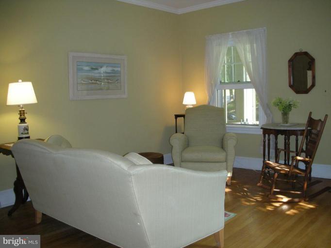 635 Deepdene Road Baltimore, MD 21210 - Photo 2 of 11 a living room with furniture and wooden floor