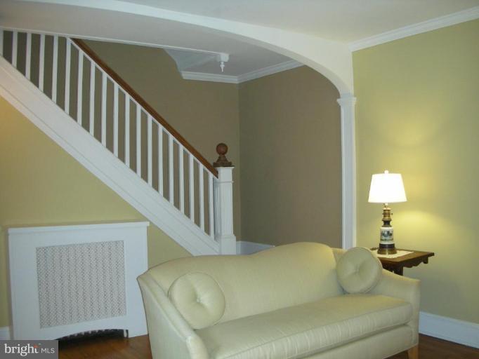 635 Deepdene Road Baltimore, MD 21210 - Photo 3 of 11 a living room with furniture and a lamp